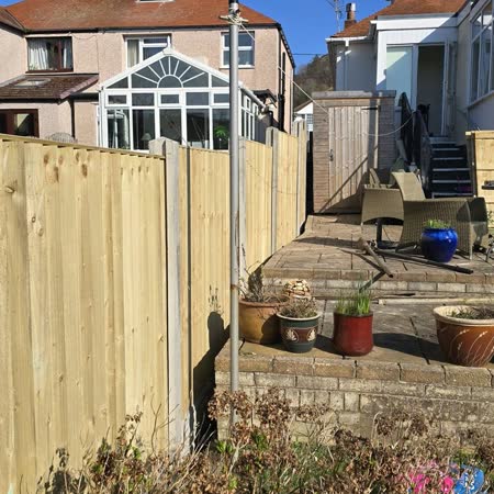 New fencing around a patio with planters